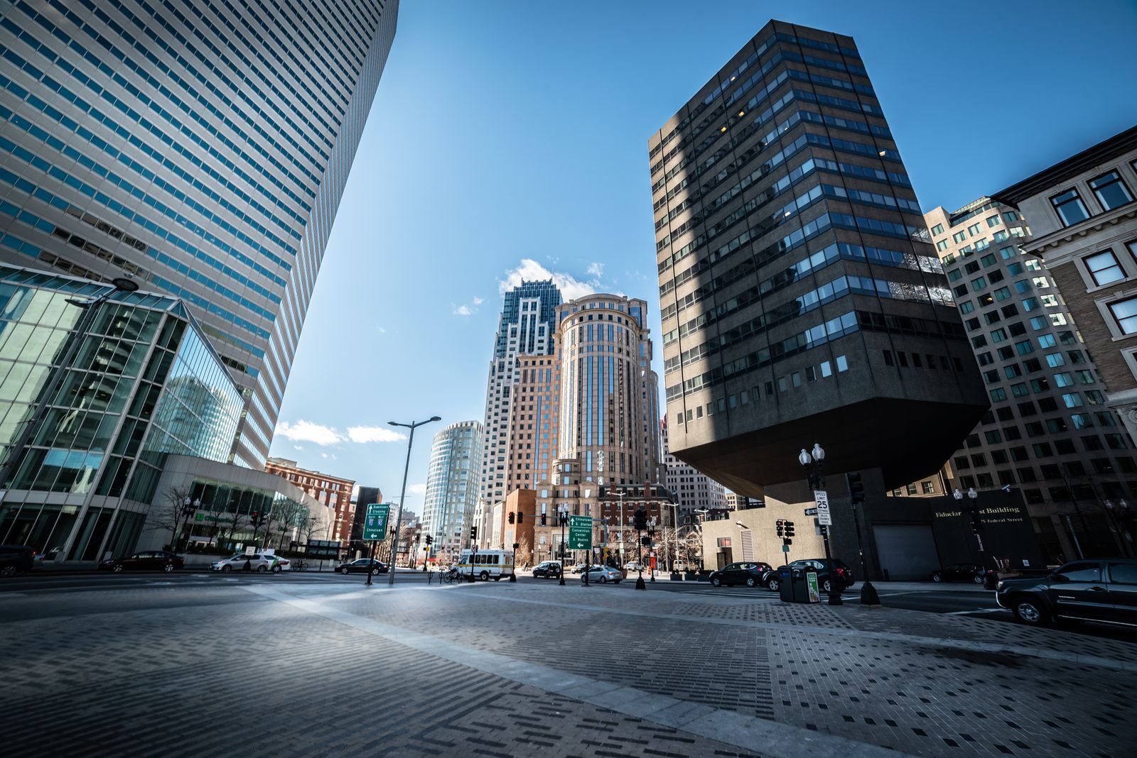 A vibrant view of Boston's downtown area showing iconic skyscrapers against a clear blue sky.